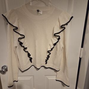 Cream Sweater with Black Ruffle Trim